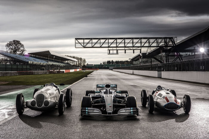 M204776 The 1937 Mercedes-Benz W 125, the 2019 Mercedes-AMG F1 W10 and the 1939 Mercedes-Benz W 165 together on the grid in Silverstone