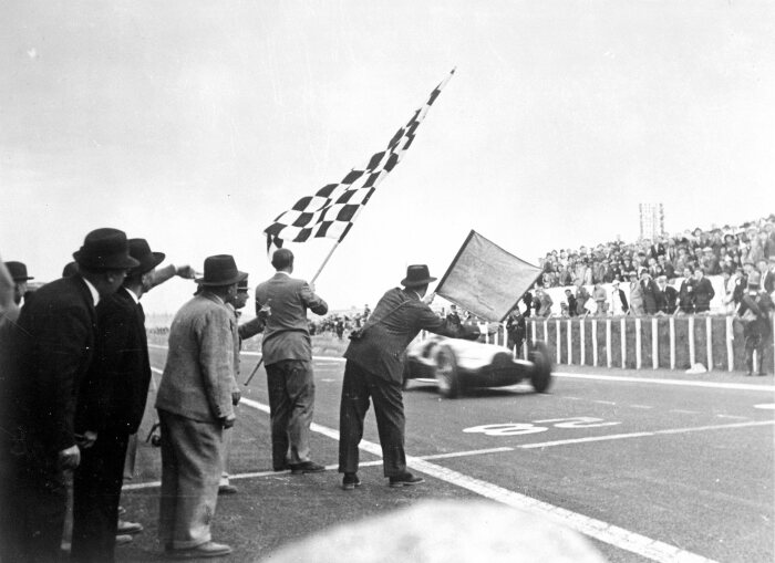 M204785 A Mercedes-Benz W 154 takes the chequered flag at the 1938 French GP