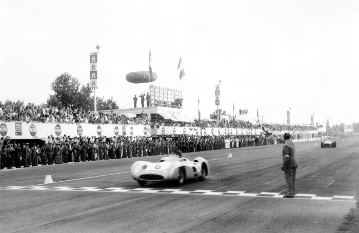 M204796 Juan Manuel Fangio at the wheel of the Mercedes-Benz W 196 R at the 1955 Italian Grand Prix
